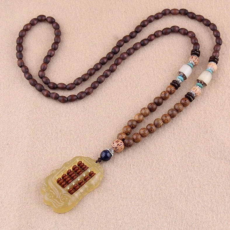 Wenge wood Buddhist necklace with yellow water drop resin pendant and silver accent beads on smooth wooden chain