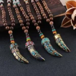 Wenge wood om mani padme hum buddhist necklace with sacred mantra pendant flat lay