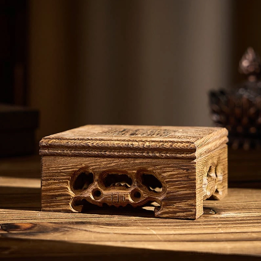 Square carved wenge wood display stand for Buddha sculpture, showing intricate floral carvings and dark rich wood finish