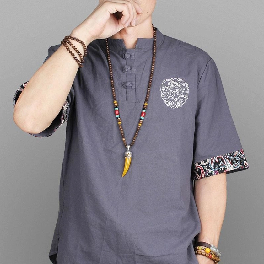 Woman wearing wenge wood turquoise horn pendant necklace with ethnic linen shirt studio model shot