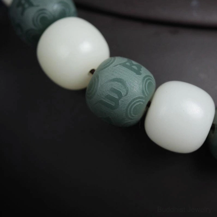 White bodhi seed six-word mantra protection bracelet full product shot showcasing natural beads and handmade craftsmanship