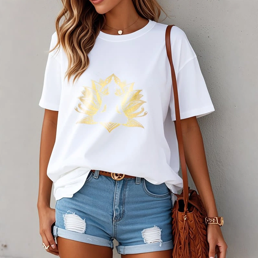 Female model wearing white lotus Buddha printed t-shirt with gold foil print, front view with denim shorts and crossbody bag