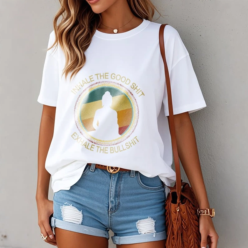 Woman in white mindfulness Buddha cotton t-shirt in casual daily setting, relaxed fit front view