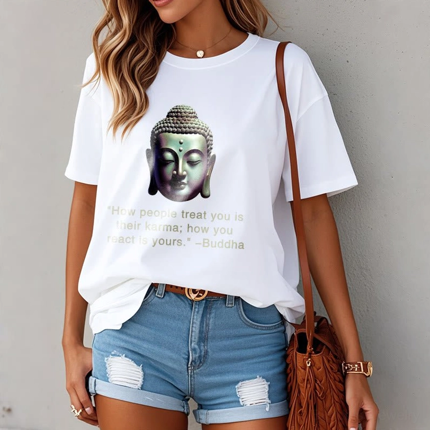 White Buddha quote t-shirt women's model partial view with denim shorts crossbody bag