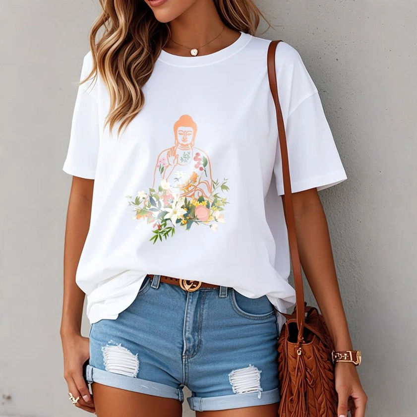 Female model wearing white Buddha floral print t-shirt indoor plain wall - peaceful mindfulness wear