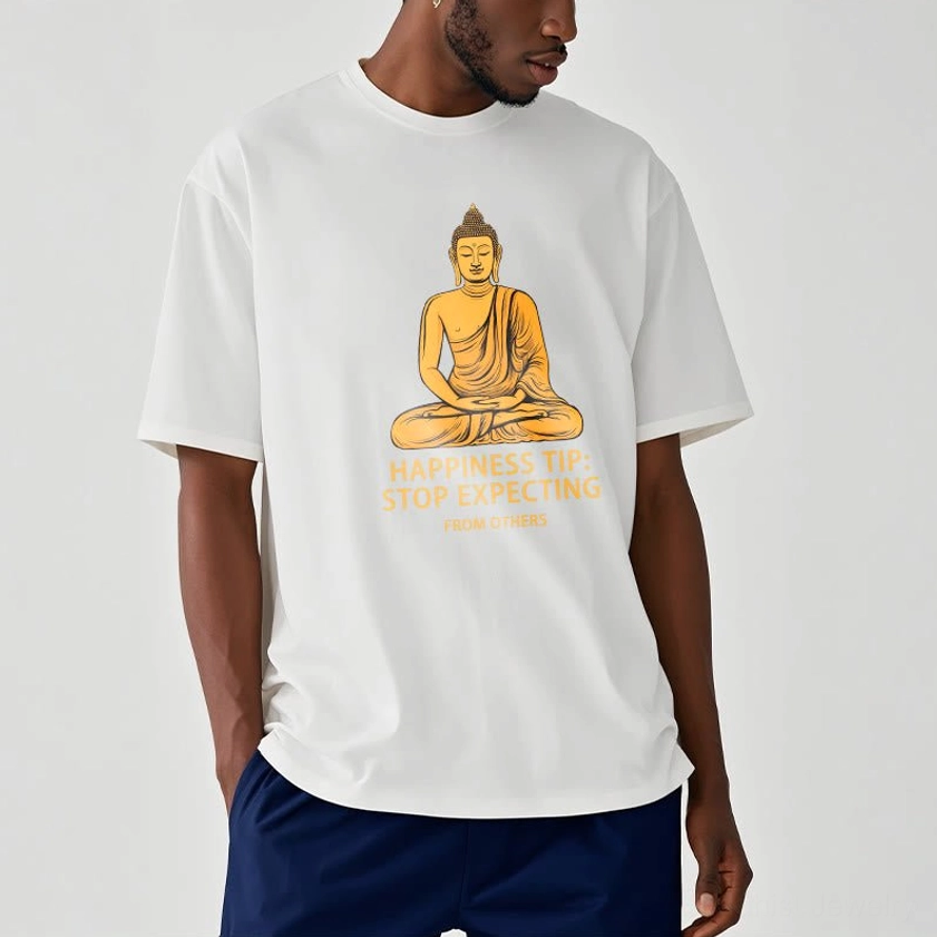 Male model wearing white Buddhist graphic tee with golden Buddha print, paired with navy blue shorts