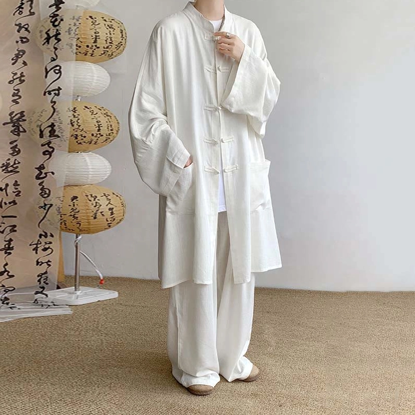White Buddhist meditation cotton two-piece set front view with traditional calligraphy lantern and frog button stand collar