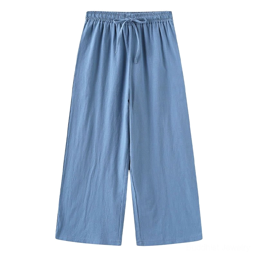 White cotton drawstring meditation pants with relaxed wide-leg silhouette