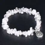 White crystal lotus bracelet top-down full view with silver engraved lotus charm pendant