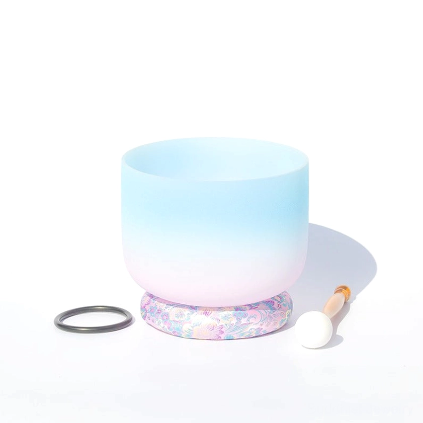 Handcrafted white crystal ombre singing bowl with blue-pink frosted finish, black rubber base, wooden mallet, and rubber ring displayed on white background