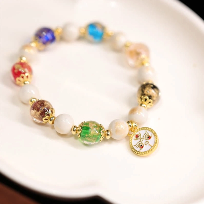 White God of Wealth Buddhist bracelet with white face enamel charm, compassionate Avalokitesvara design for righteous prosperity