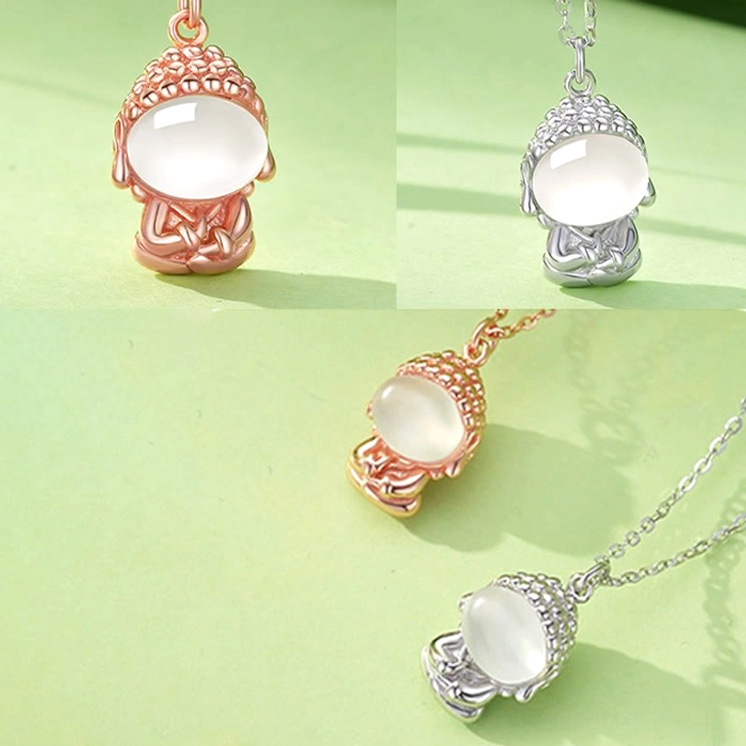 White gold chalcedony Buddha pendant necklace with luminous stone detail, elegant spiritual jewelry studio photograph