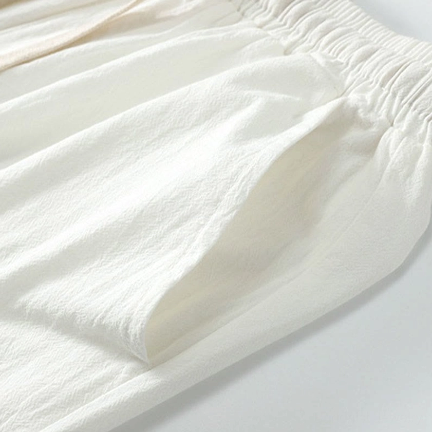 White Hanfu top front view showing traditional cross-collar V-neckline and loose fit