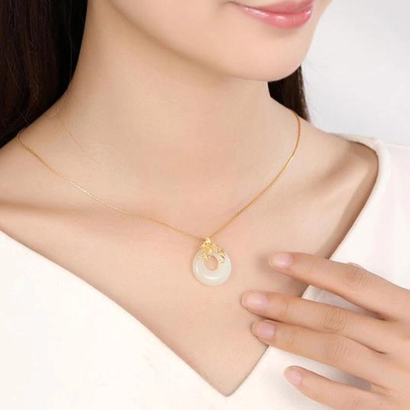 Woman wearing white jade Buddhist necklace on collarbone in daily setting, showing how pendant sits on neck with delicate gold chain