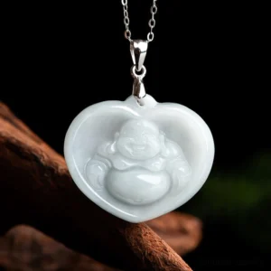 Heart-shaped white jade laughing Buddha pendant necklace with titanium steel chain, front view showing carved Buddha figure