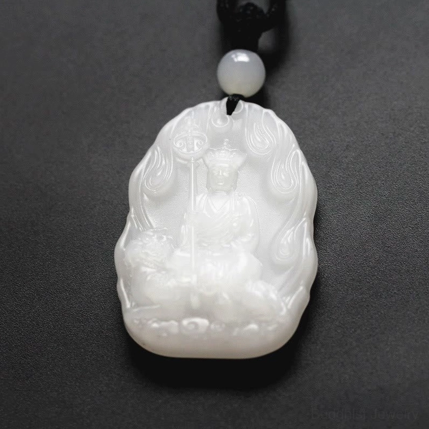 White Ksitigarbha Buddha carved pendant with flame border and seated Buddha on sacred beast, matte finish
