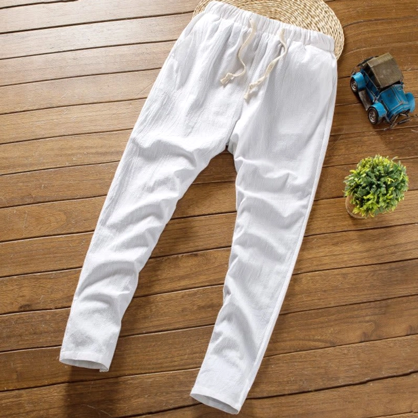 White linen drawstring pants oblique flat lay view elastic waist mens meditation suit
