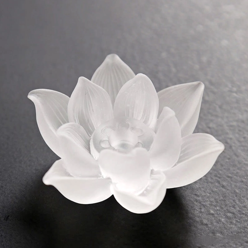 Frosted white lotus incense holder front close-up layered petal design dark background