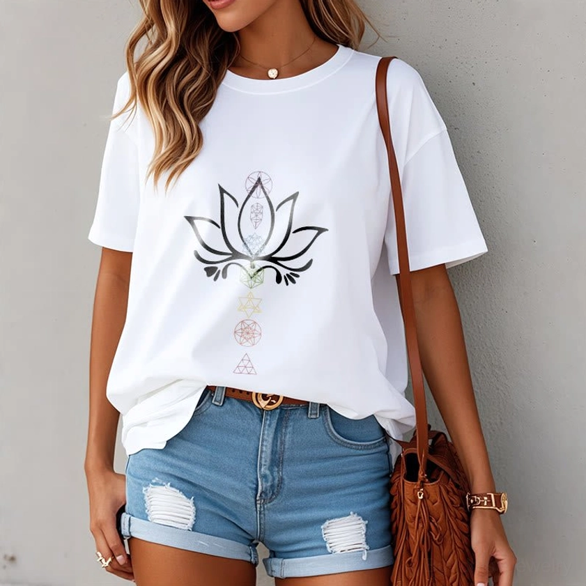 Female styled white lotus tee outdoor street style ripped denim shorts street wear