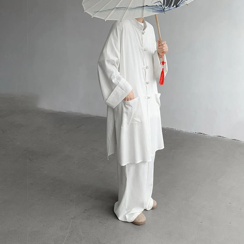 White Buddhist meditation cotton set left side view showing frog button shirt and side pocket detail