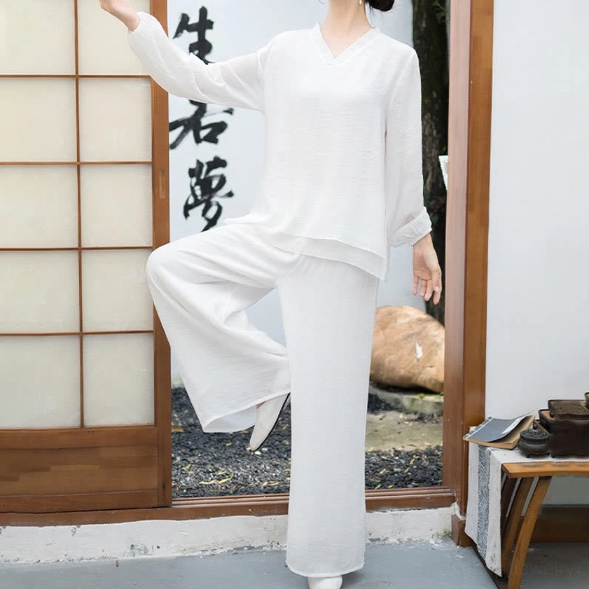 White meditation loungewear set side view showing relaxed fit and flowing silhouette