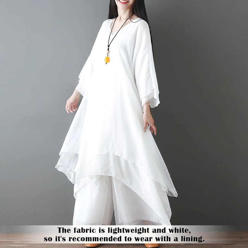 White Zen meditation clothing three-quarter front angle showing layered sheer fabric and loose fit design for mindful movement