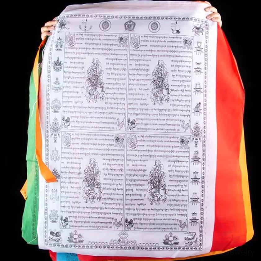 White Buddhist windhorse prayer flag with black printed sacred symbols and mantras held by hands
