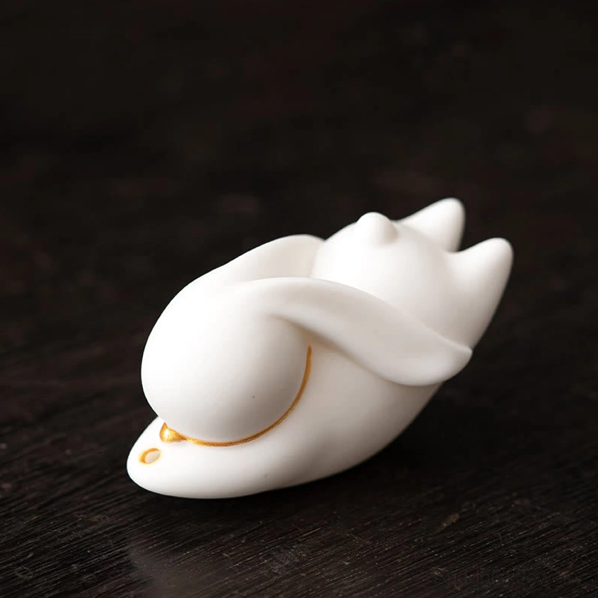 White ceramic rabbit incense burner with bamboo mat detailed product photography for online shop