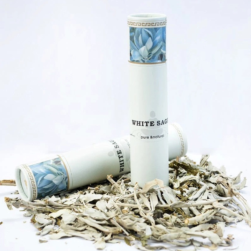White sage incense sticks premium bundle with natural paper packaging and dried sage leaves in studio setting