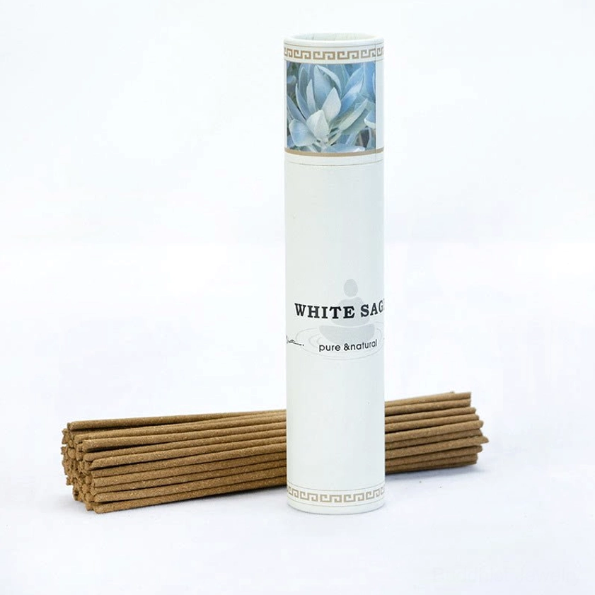 White sage incense sticks standing branded tube with loose incense sticks front view studio photography