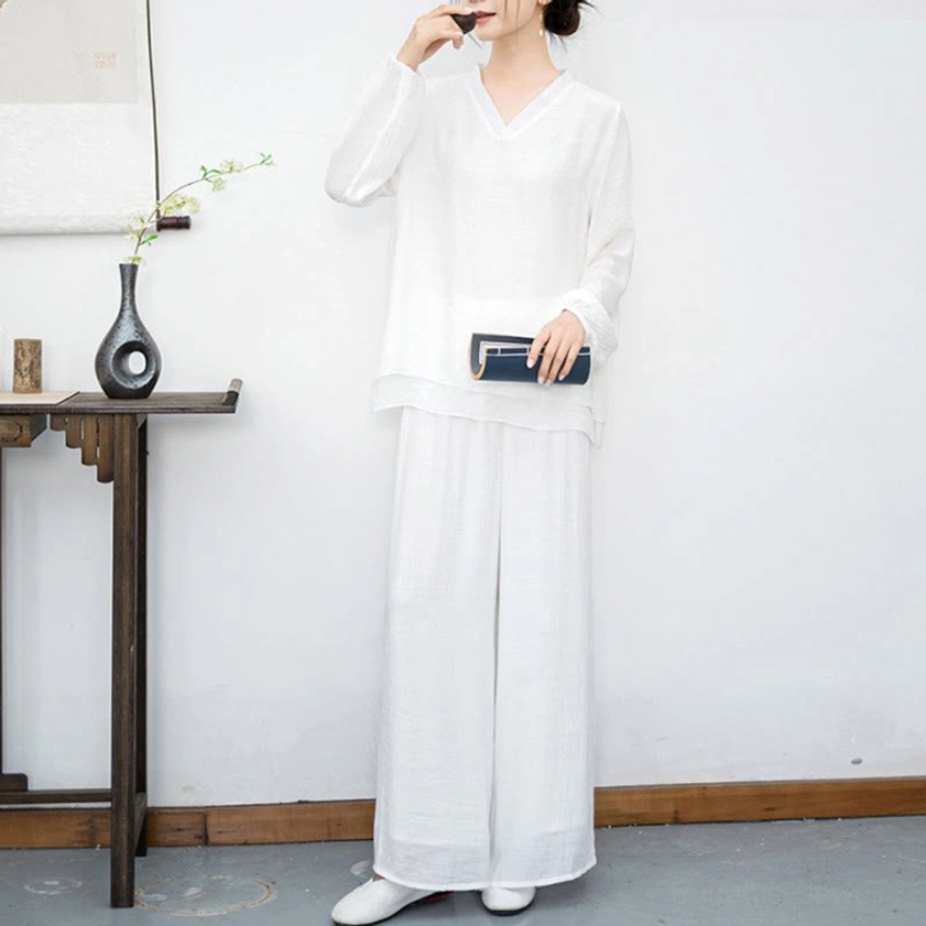 White Tai Chi meditation set worn with accessories in minimalist studio setting