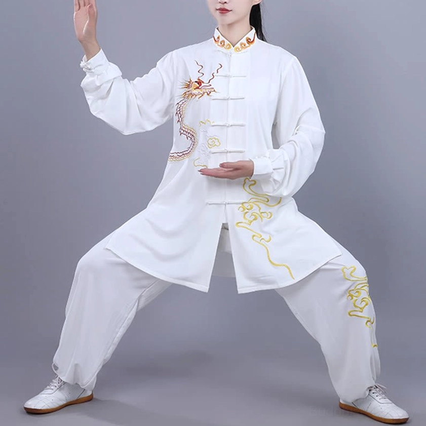White tai chi meditation uniform with golden dragon embroidery in action pose