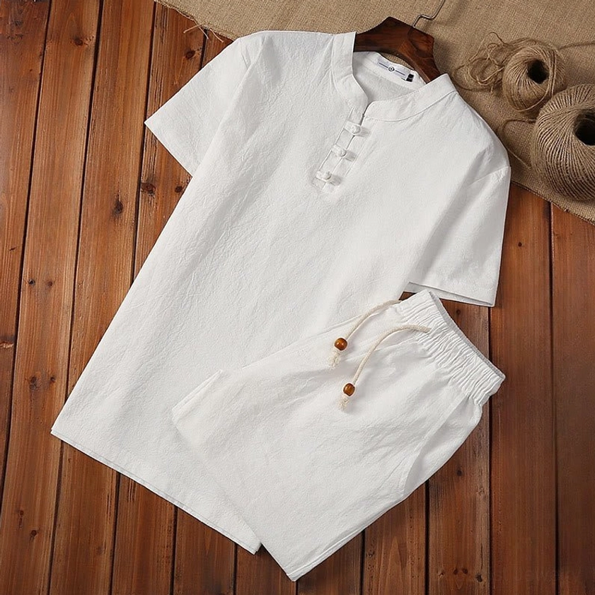 White cotton linen Tang suit two-piece set with frog buttons and wooden bead drawstring, overhead view