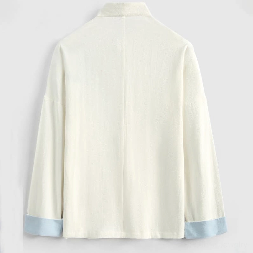 Back view of white crane embroidery Tang suit jacket with off-white linen and light blue cuffs
