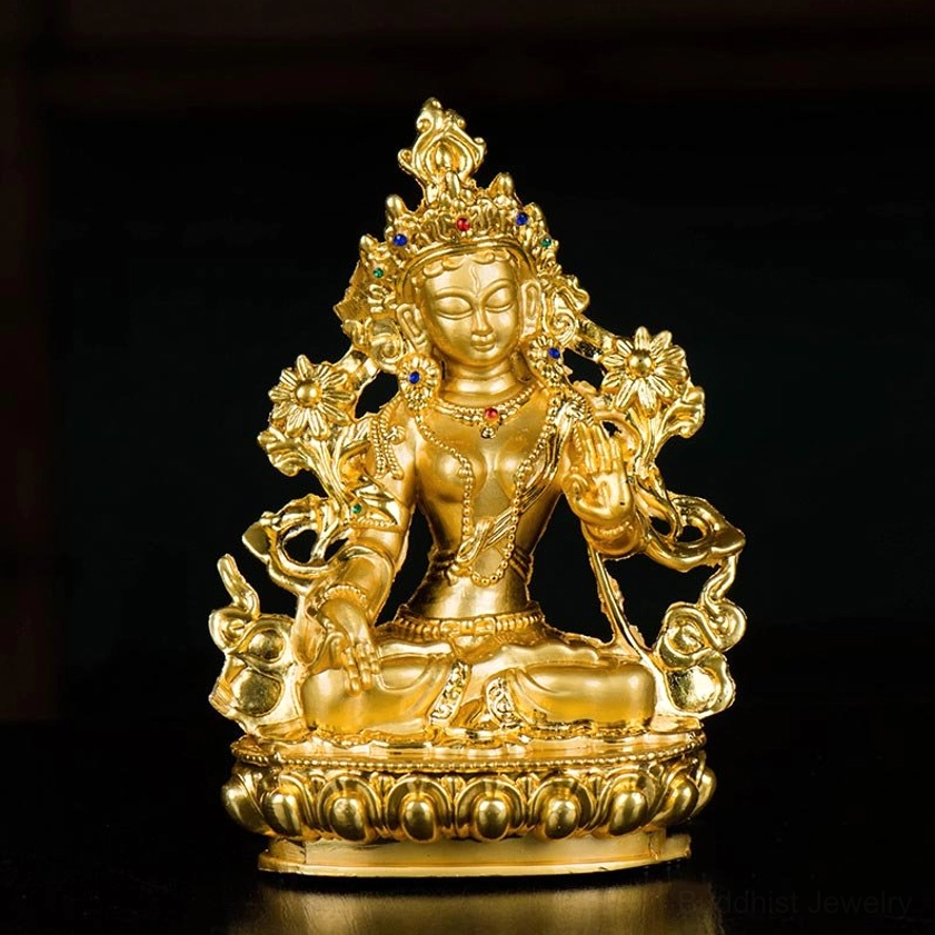 White Tara Buddha statue front view on black background showing polished gold finish and intricate carved details