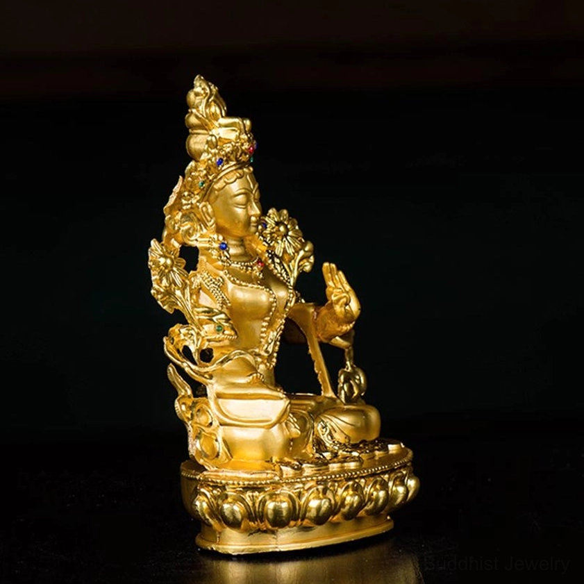 White Tara compassion deity statue right side profile showing detailed head ornament and seated spiritual posture