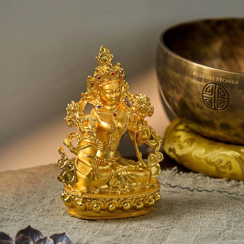 White Tara gold plated Buddha statue three-quarter angle view with bright gilded finish and ornate details