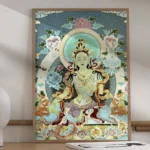 White Tara handmade embroidery thangka tapestry framed in wooden frame displayed on home tabletop with decorative floral border