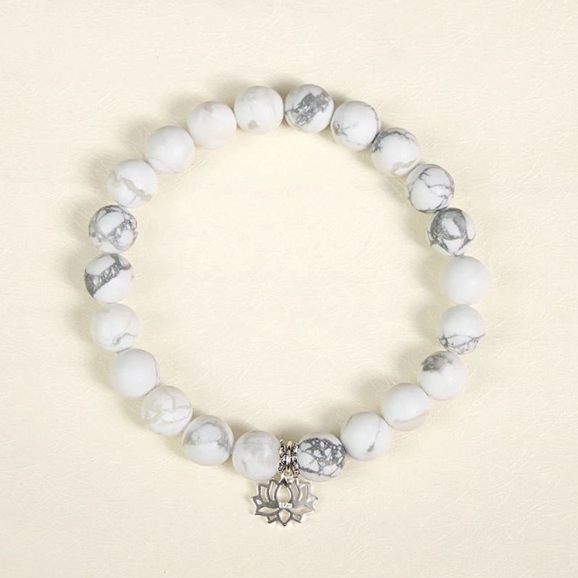 White turquoise beads with silver spacer details showing craftsmanship of handmade Buddhist lotus bracelet