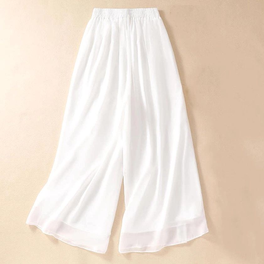 White wide leg pants detail showing natural waistline with elastic band, functional side pockets, and full-length cut for spiritual practice
