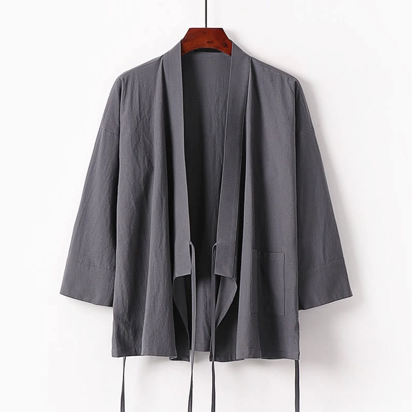 White wrap kimono meditation top with tie waist and side pocket hanging display