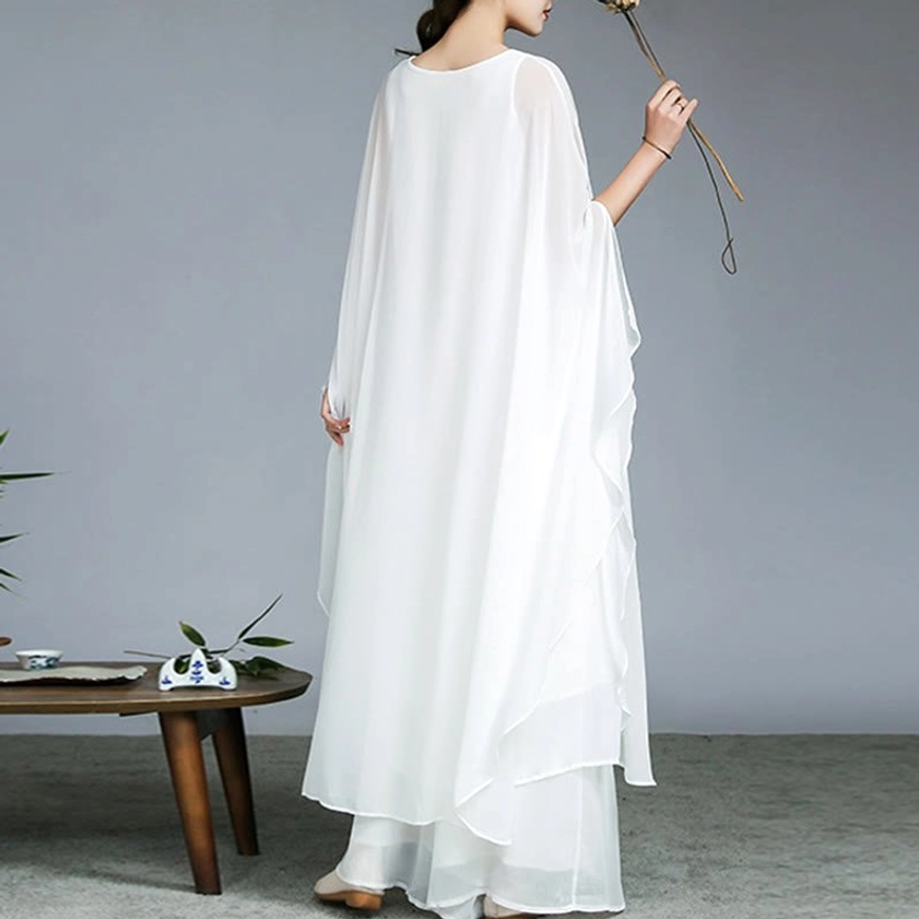 Back view of white chiffon Zen meditation outfit showing flowing layered hem for unrestricted movement in yoga