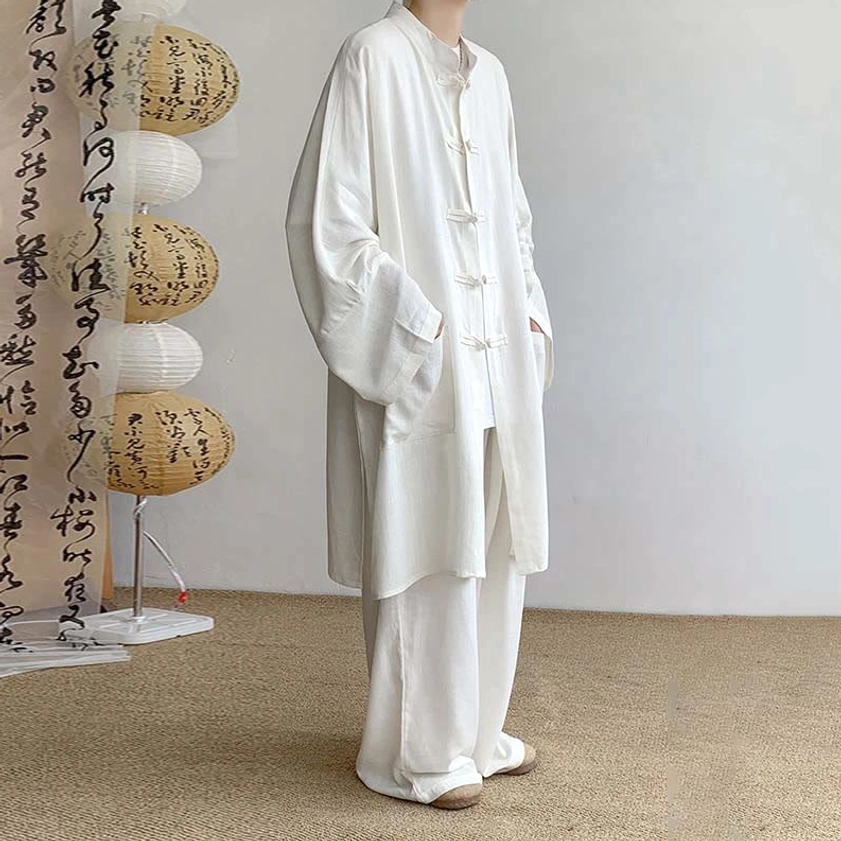 White Buddhist meditation outfit right side view with oversized sleeves and wide-leg pants detail