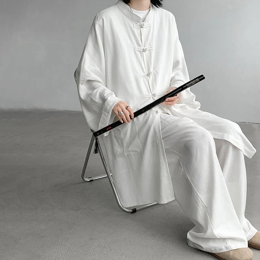 White Buddhist meditation two-piece set seated front view with frog button stand collar and folding fan prop