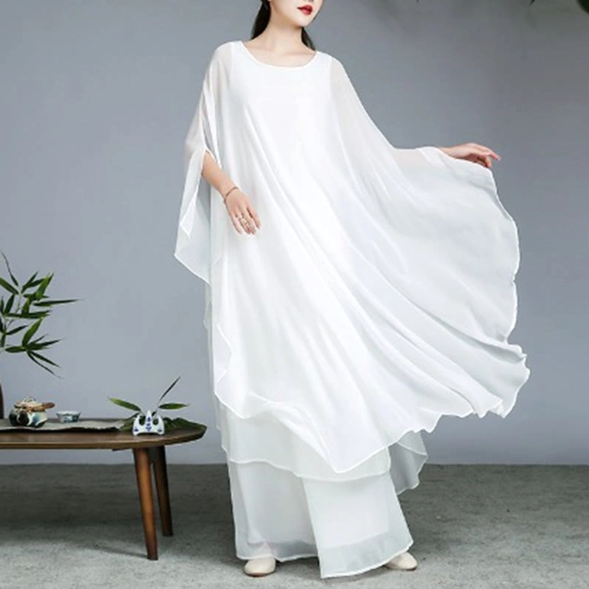 White Zen meditation two-piece set three-quarter view with wind-blown wide sleeves demonstrating fabric flow and comfort