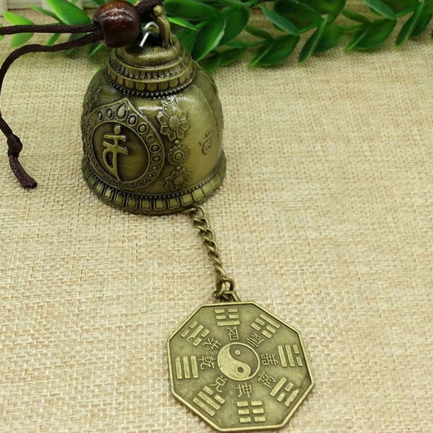 Handcrafted Buddhist wind chime bell detail showing artisanal bronze patina finish