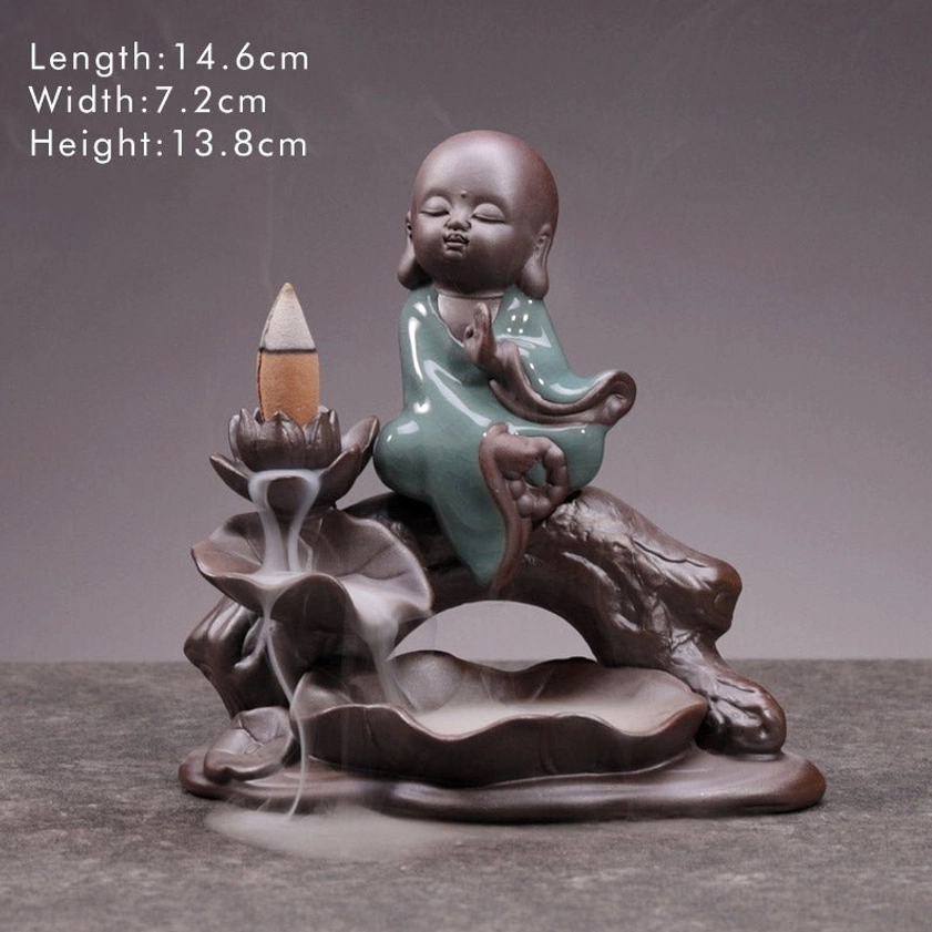 Wishing Little Monk backflow incense burner with size markings, studio product display, brown ceramic base and celadon glaze robes, smoke flowing down lotus stand