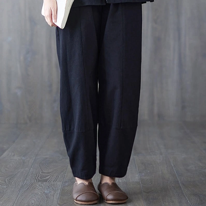 Women's black elastic waist meditation pants - detailed view of natural waistline and comfortable fit for practice