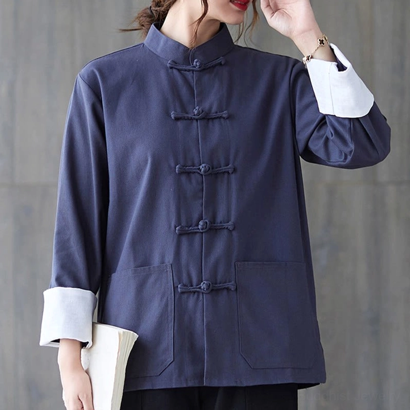 Women's blue frog-button cotton linen meditation shirt with white contrast cuffs and toggle closures