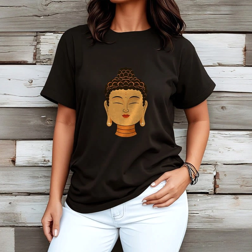 Woman wearing black Buddha meditation t-shirt paired with white jeans wooden wall background
